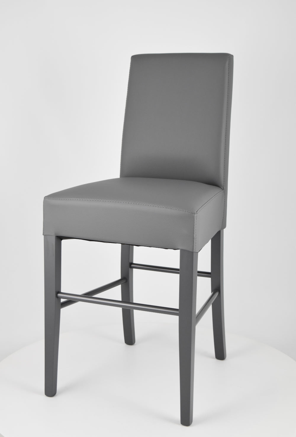 Luisa low stools in beech wood structure, padded seat and backrest covered in artificial leather