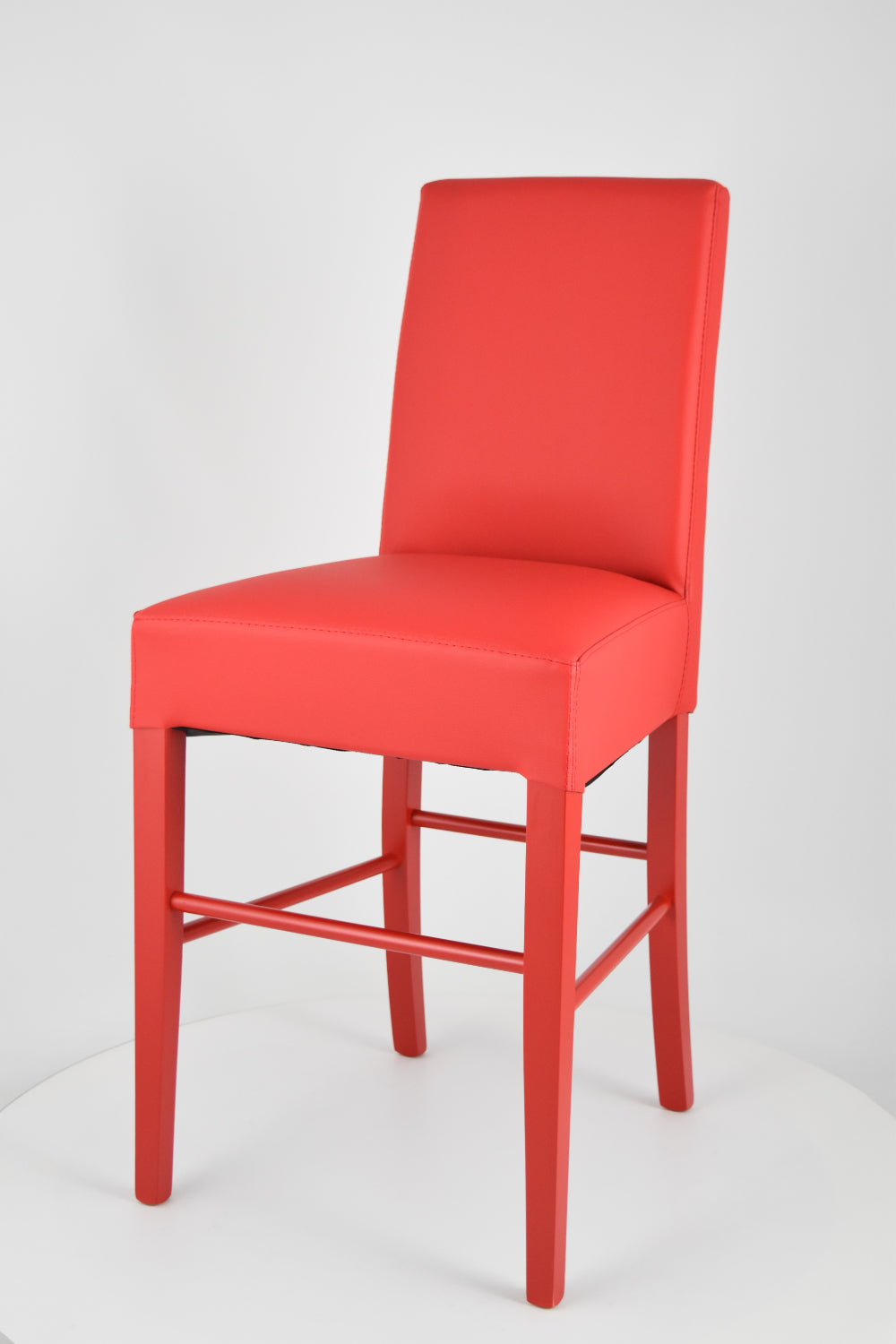 Luisa low stools in beech wood structure, padded seat and backrest covered in artificial leather