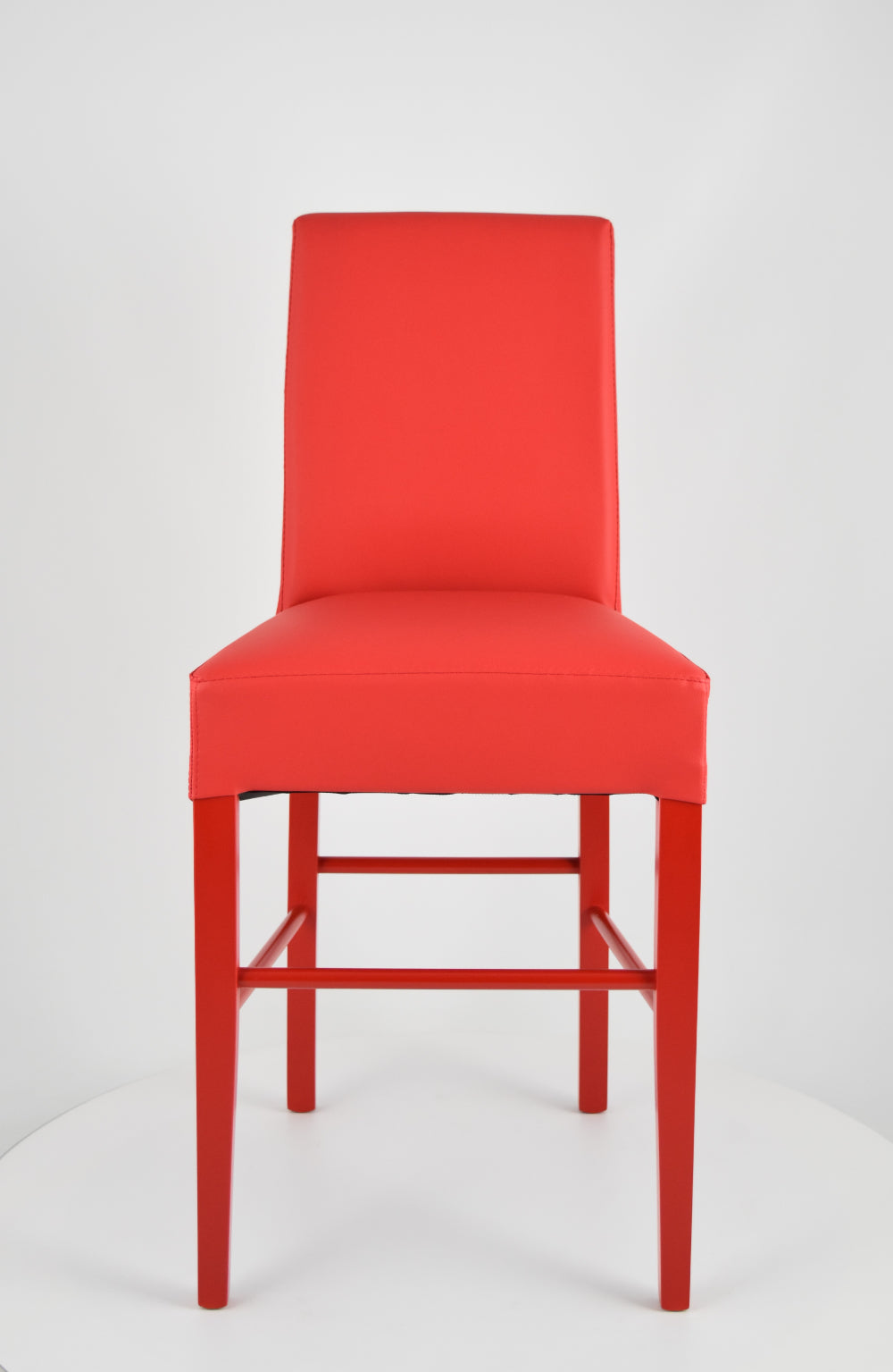 Luisa low stools in beech wood structure, padded seat and backrest covered in artificial leather