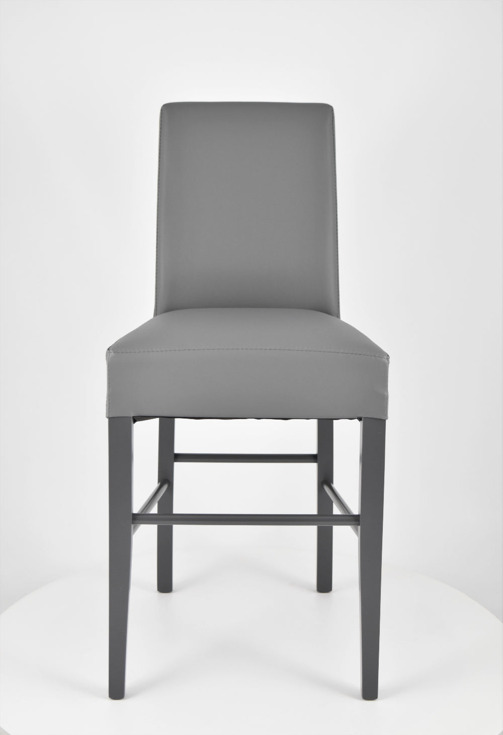 Luisa low stools in beech wood structure, padded seat and backrest covered in artificial leather